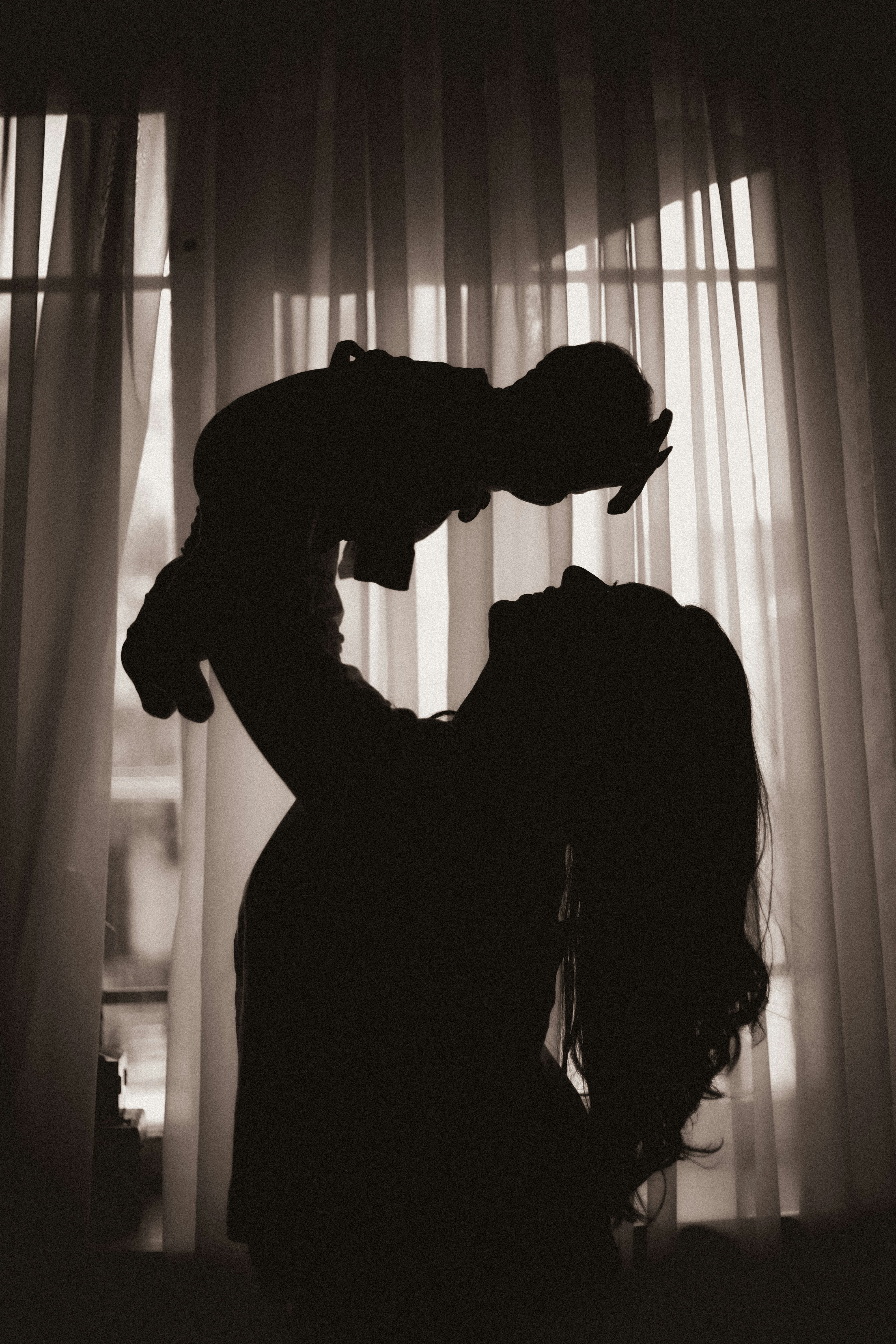 Eltern mit Kind – Familienmoment Silhouette